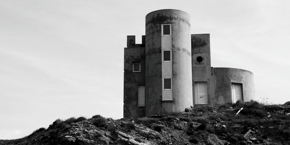 gray concrete building on gray rocky ground during daytime