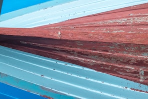 Close-up of textured marine paint on a ship’s deck, demonstrating durability against saltwater exposure.