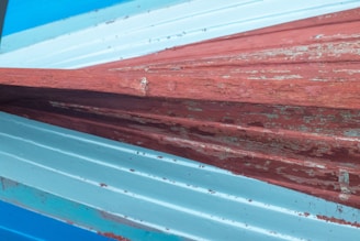 Close-up of textured marine paint on a ship’s deck, demonstrating durability against saltwater exposure.
