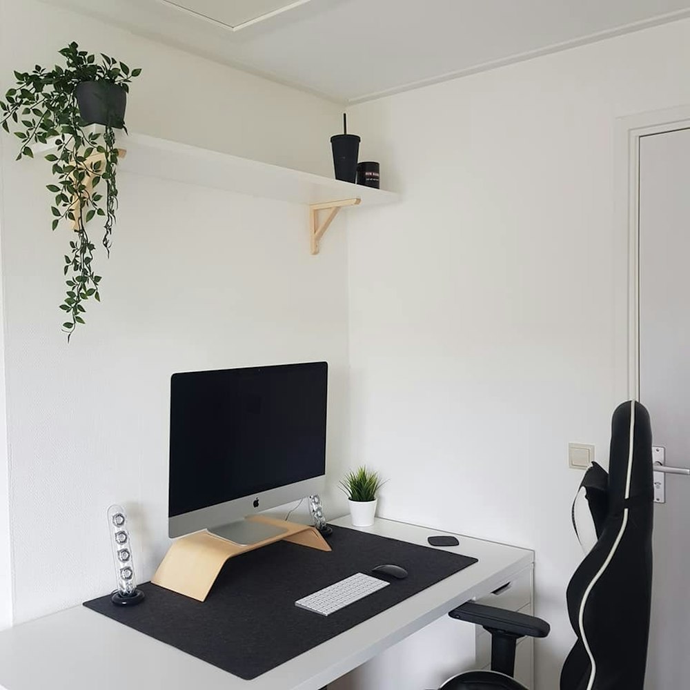 black flat screen tv on white wooden table