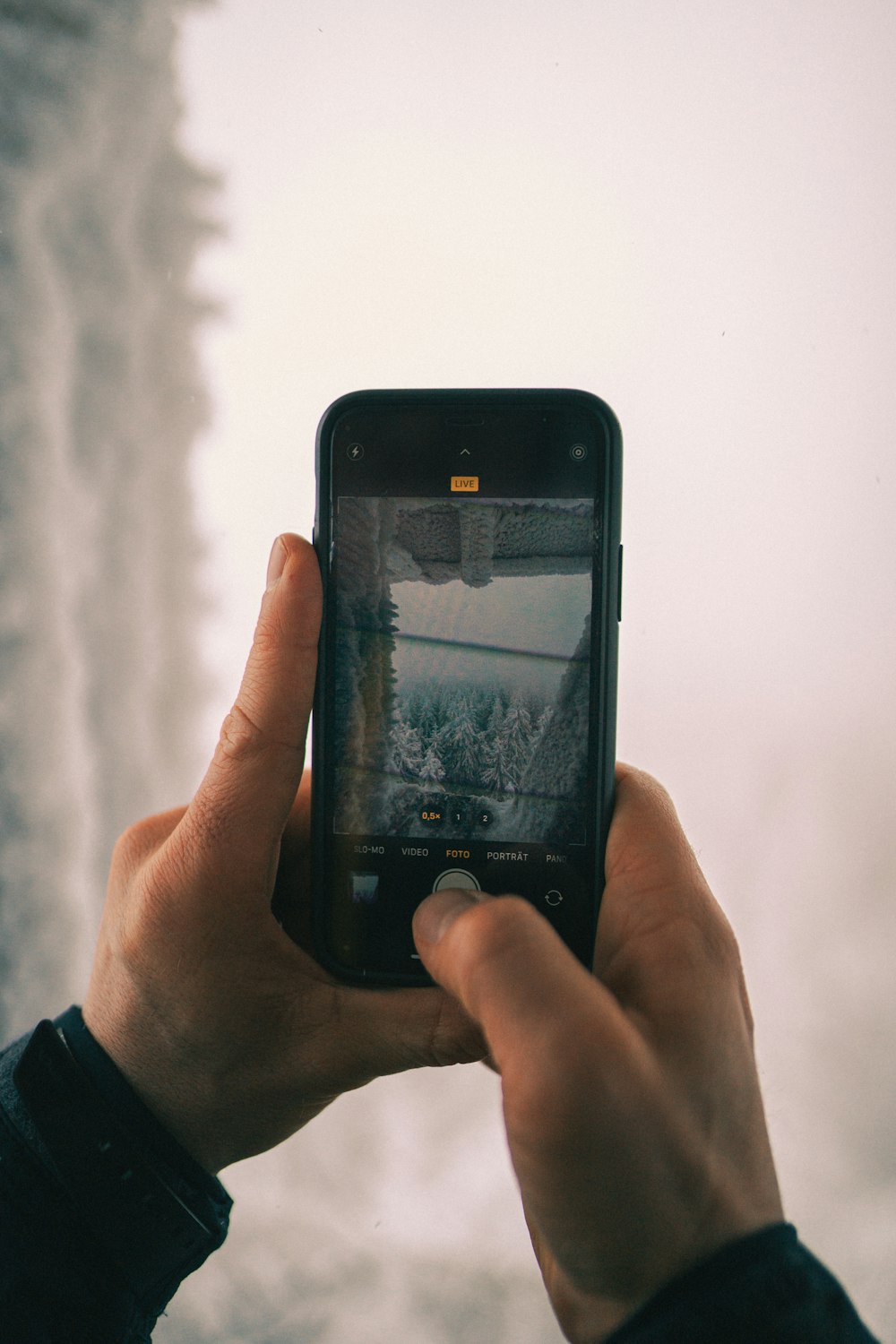 person holding black iphone 4