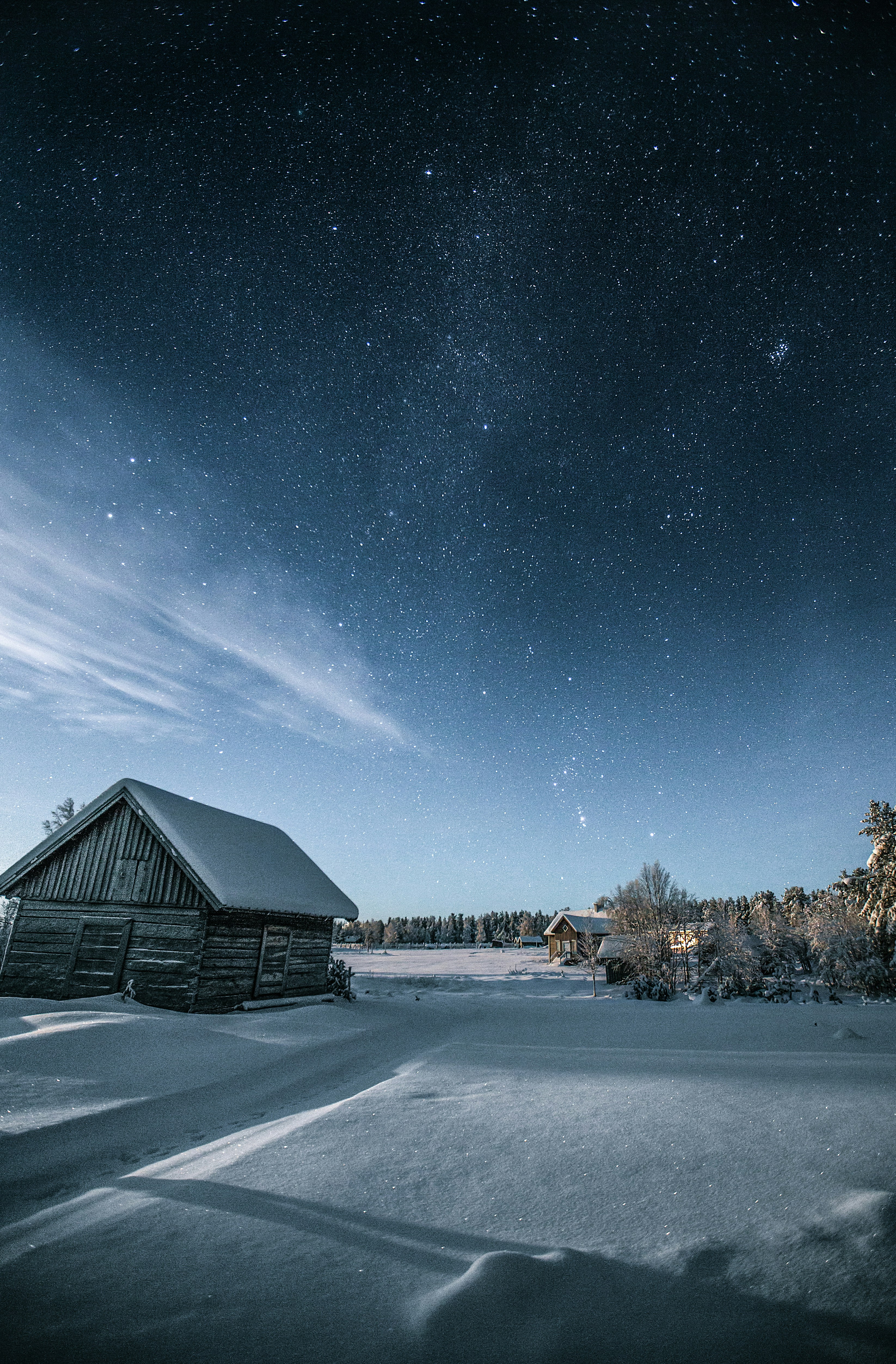 brown wooden house under starry night
