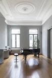 black grand piano near window