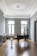 black grand piano near window