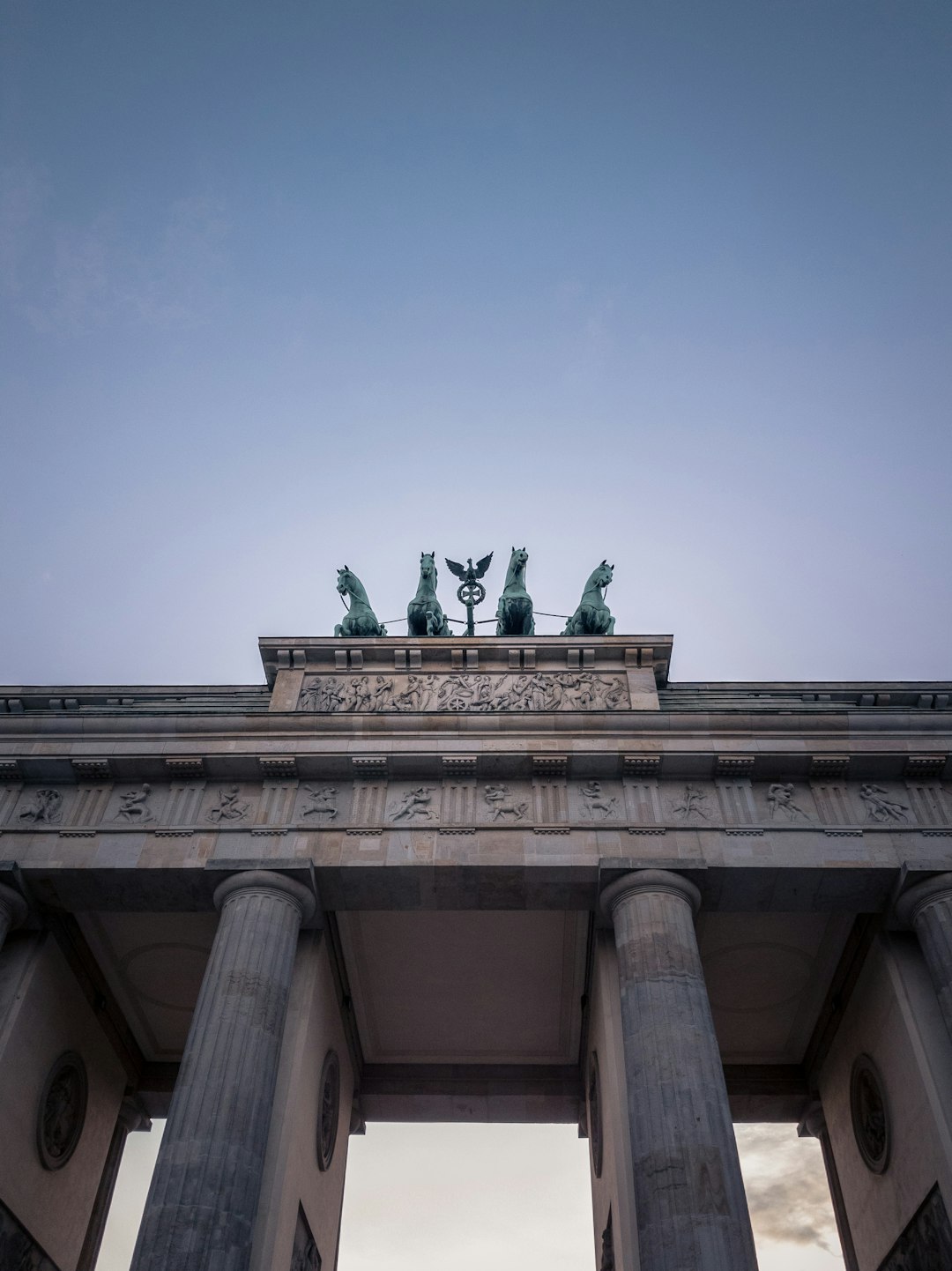 green statue on top of building