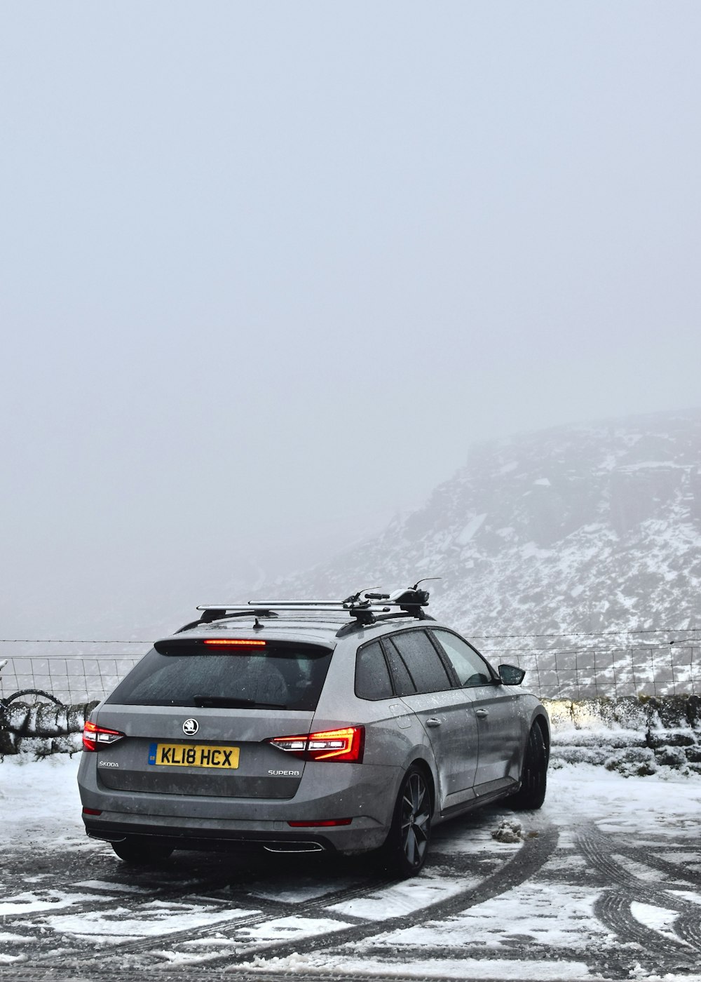 black honda car on snow covered ground during daytime