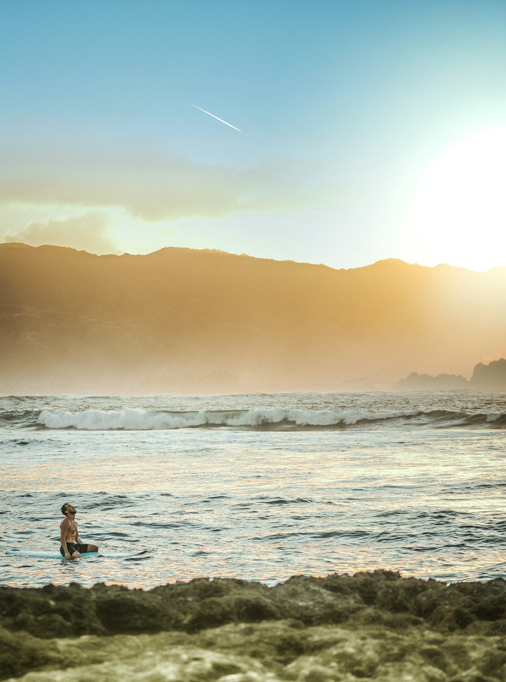 2 person standing on beach during sunset