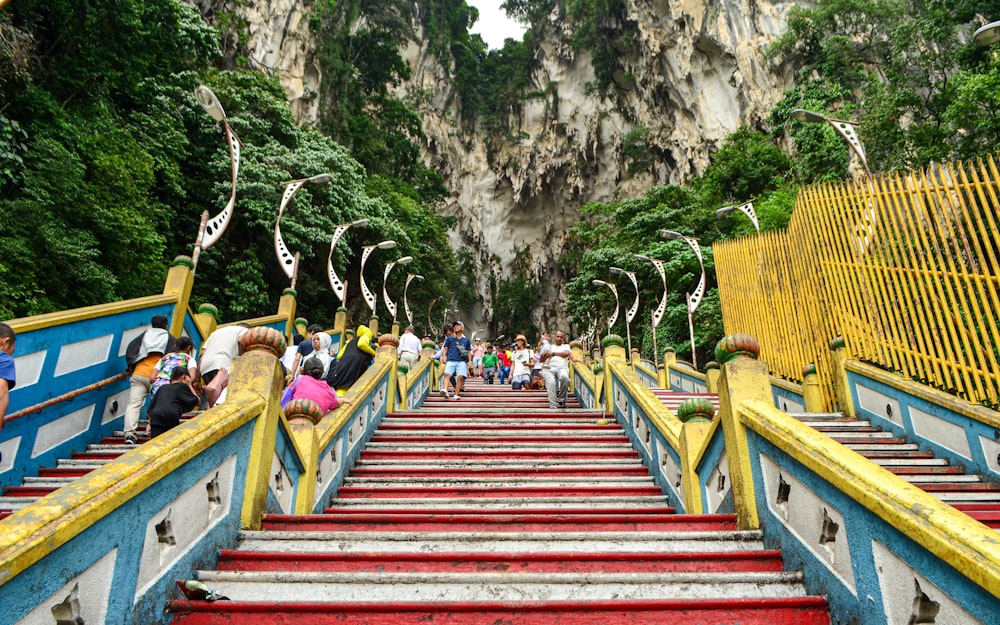 people walking on wooden stairs