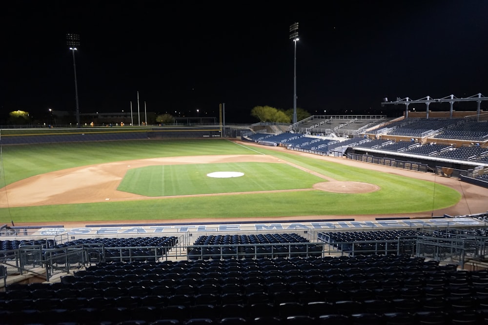 green and white football field during night time