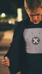 man in black and white sweater