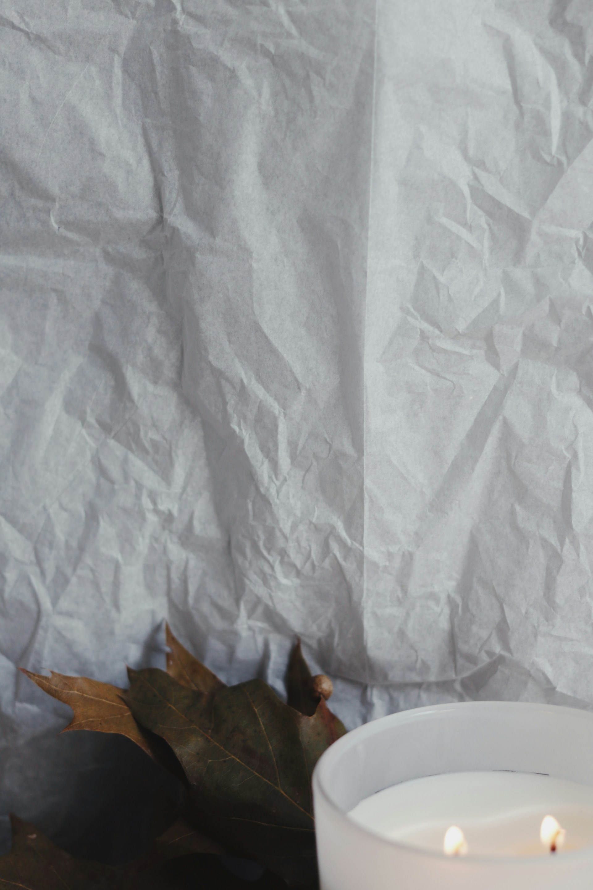 white ceramic plate on white table cloth