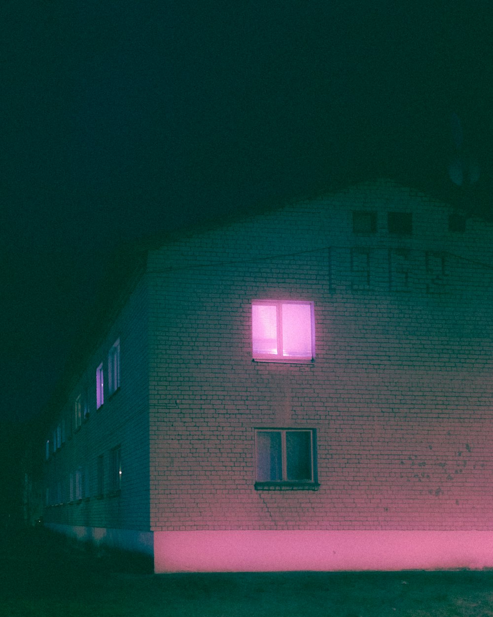 pink and white concrete building during nighttime