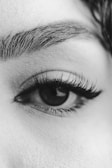 grayscale photo of persons eye