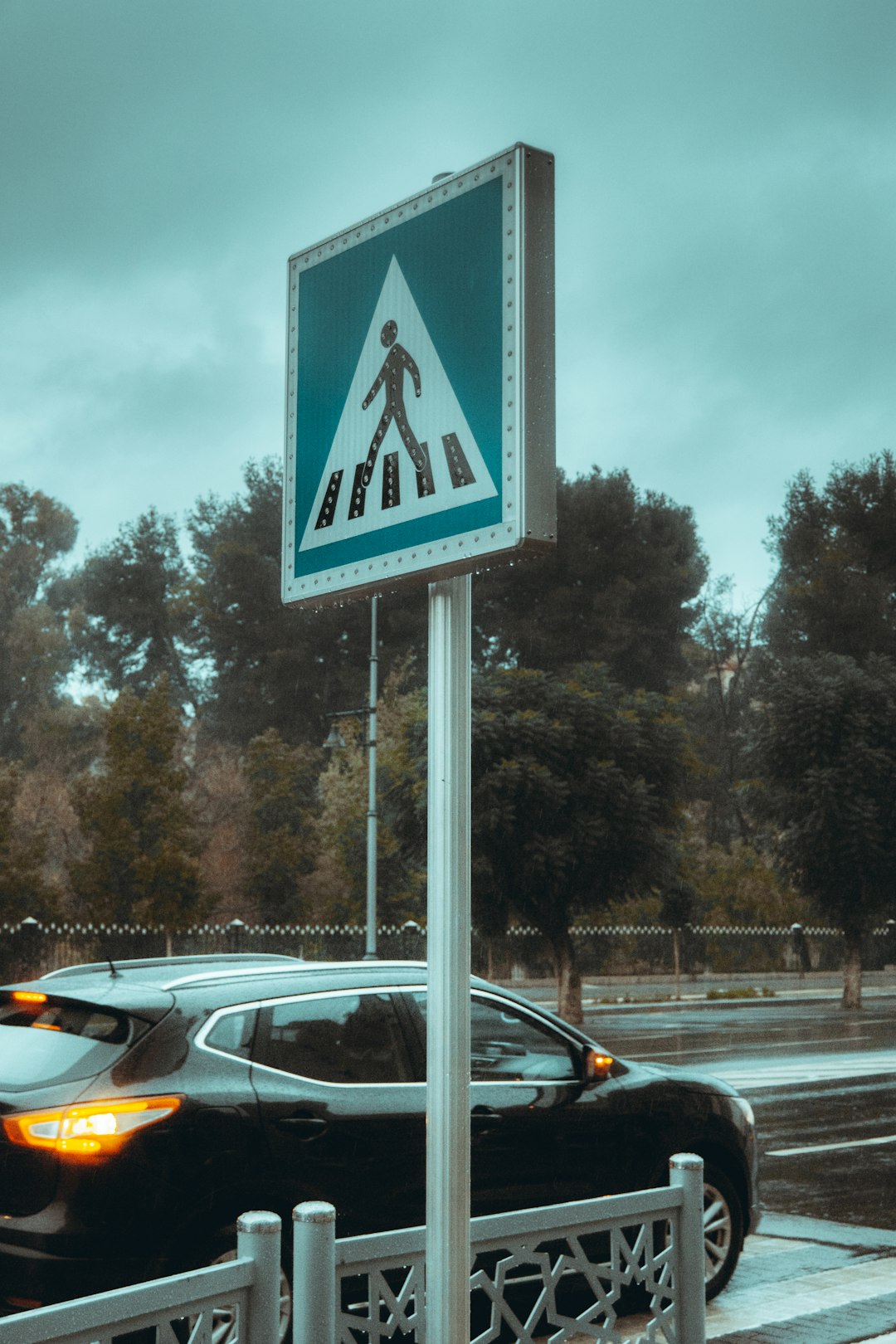 blue and white pedestrian lane sign