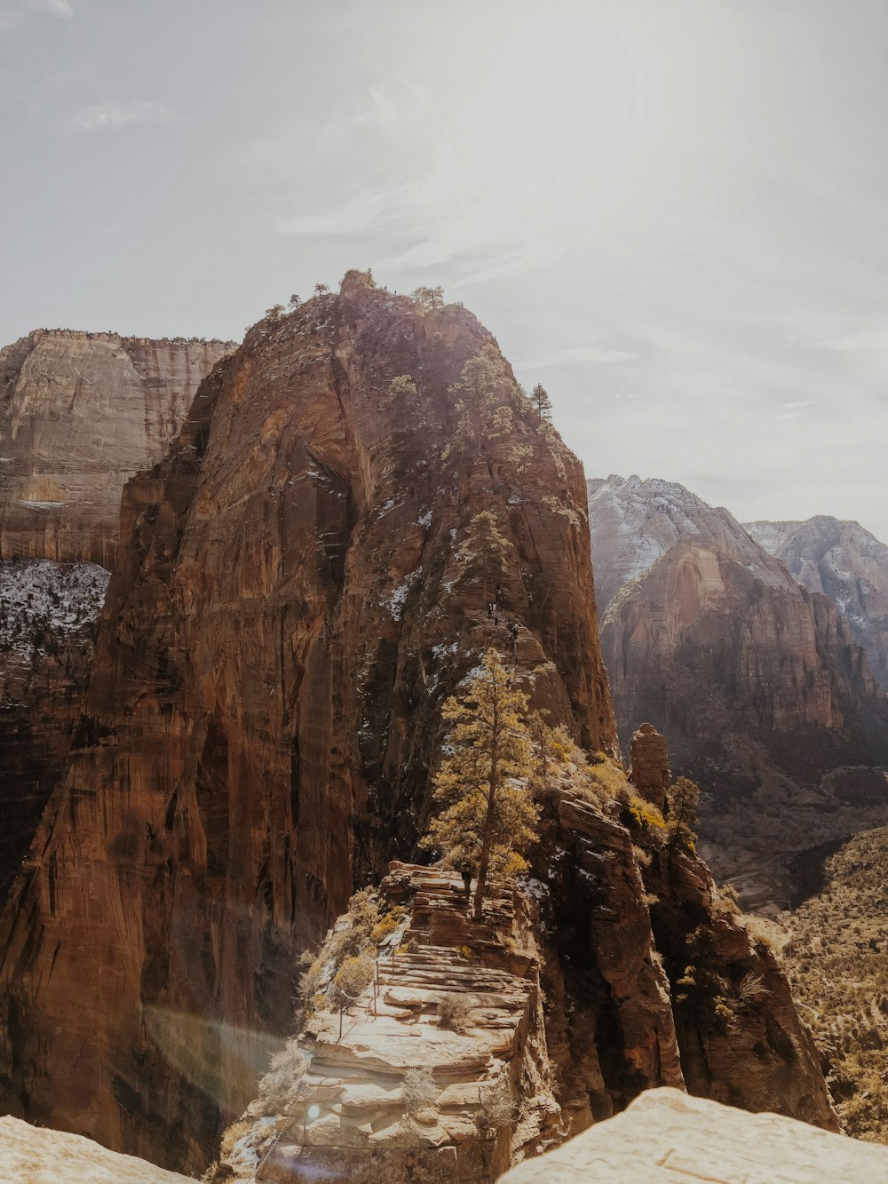 brown rocky mountain under white sky during daytime