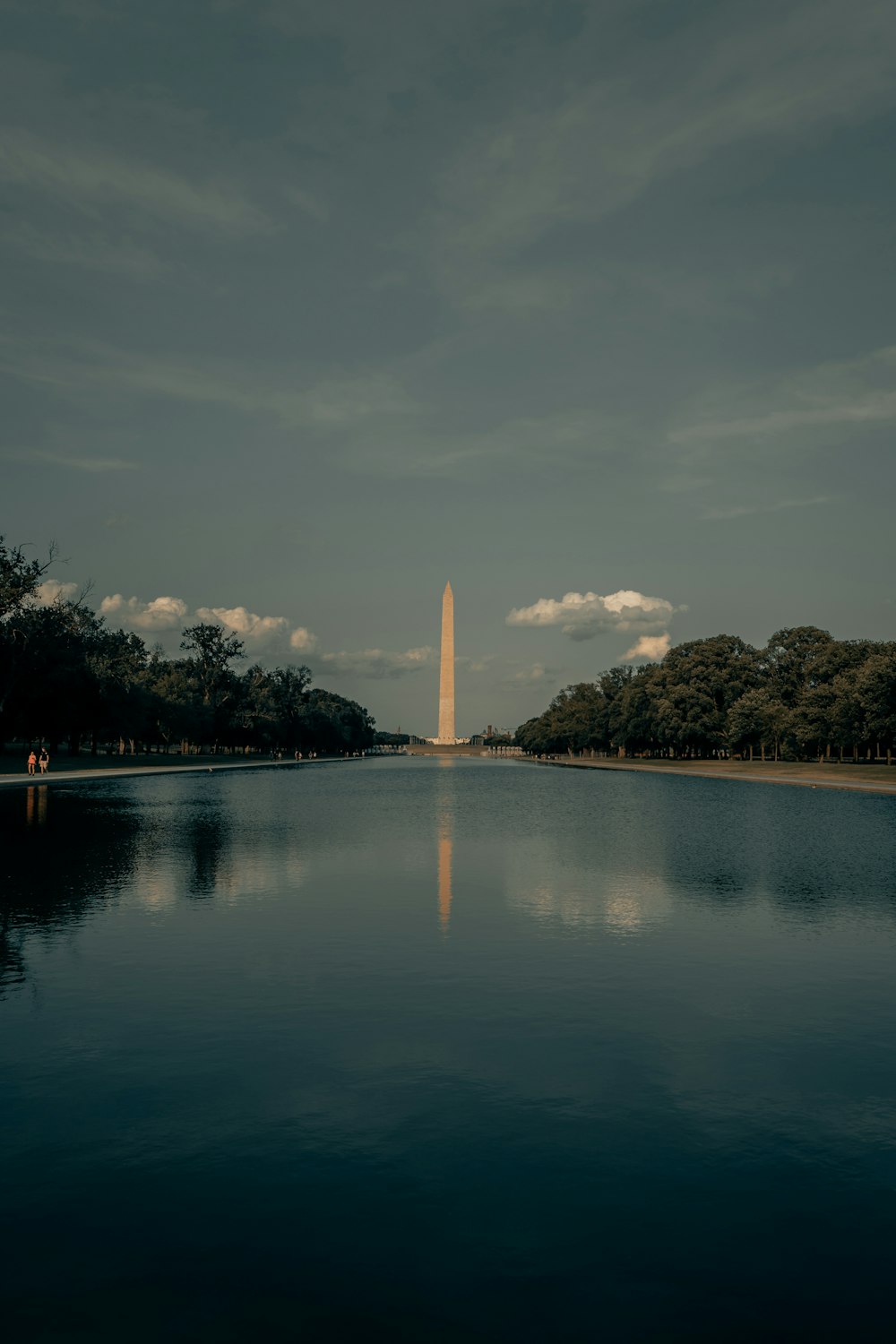 white tower near body of water during daytime