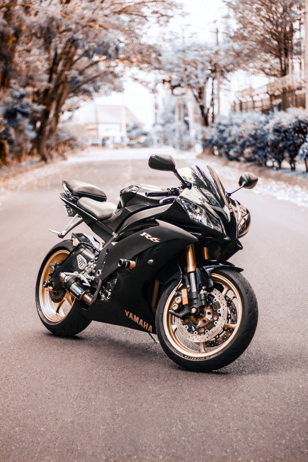 black sports bike on road during daytime