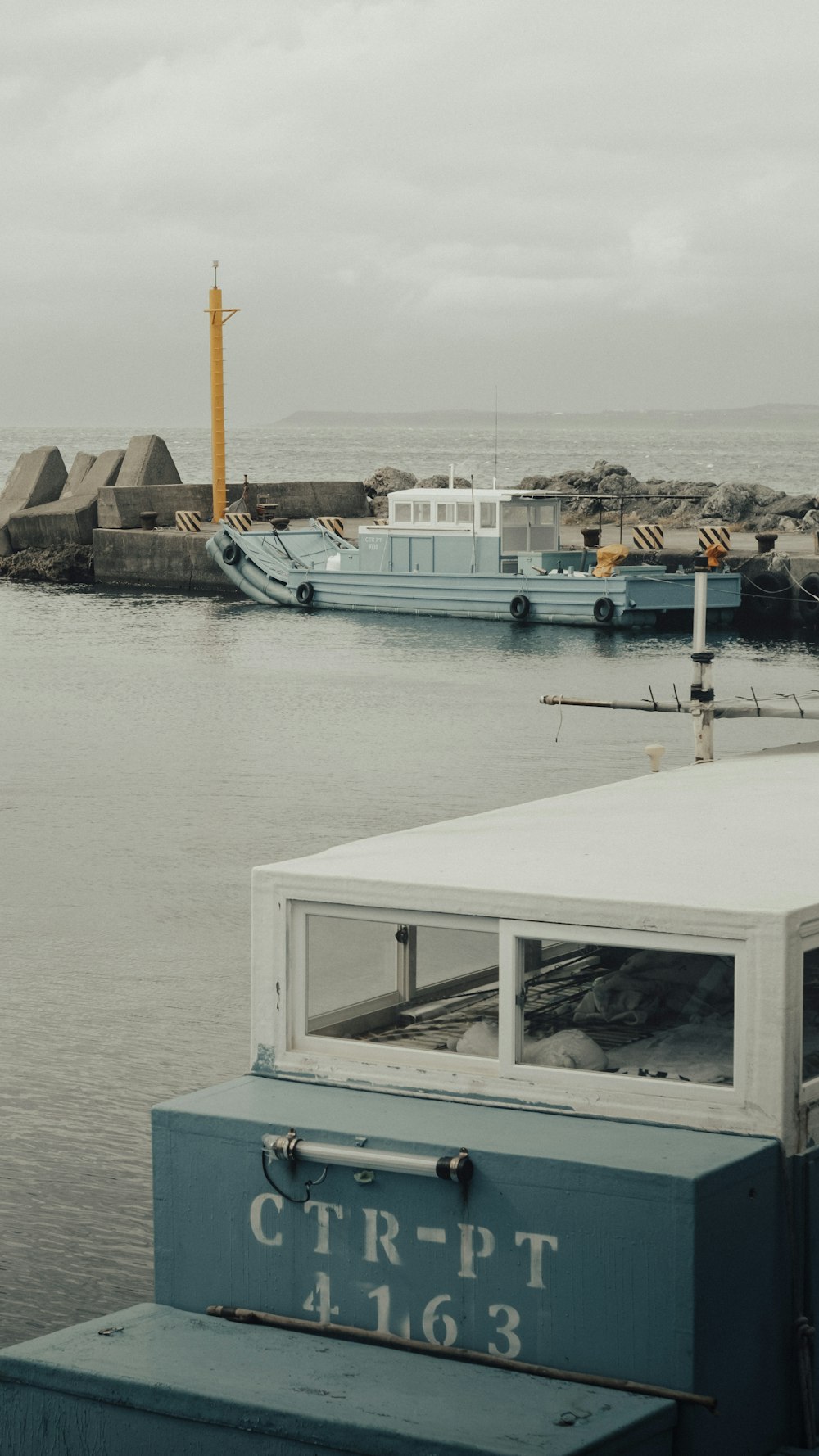 white and blue boat on water during daytime