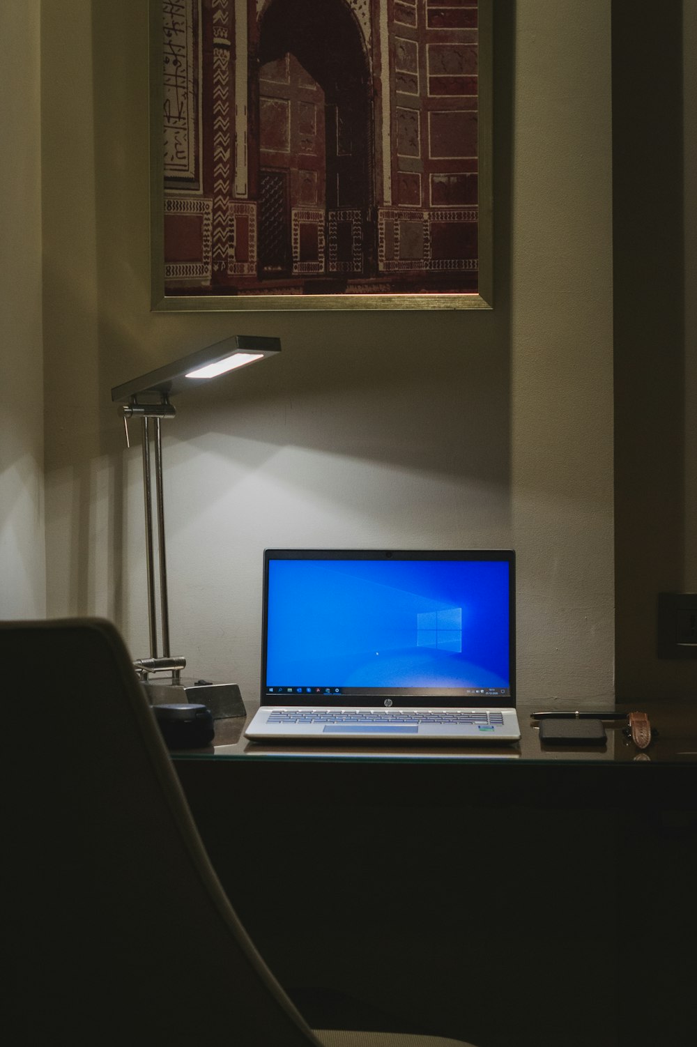 black and silver laptop computer on white table