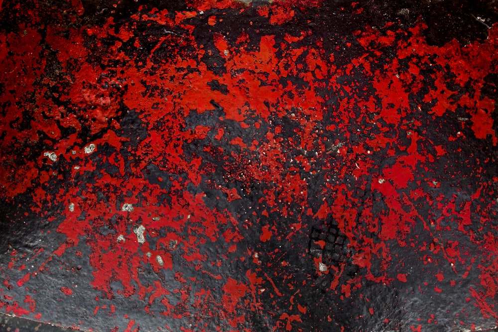 a close up of a red and black object