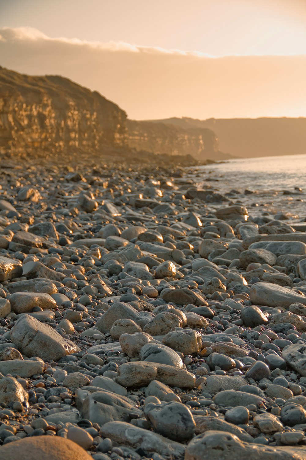 black and gray stones on seashore during daytime