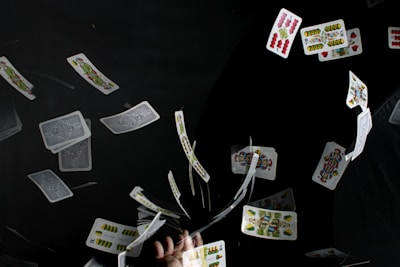 playing cards on black textile