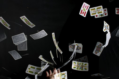 playing cards on black textile