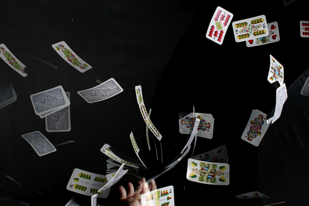 playing cards on black textile