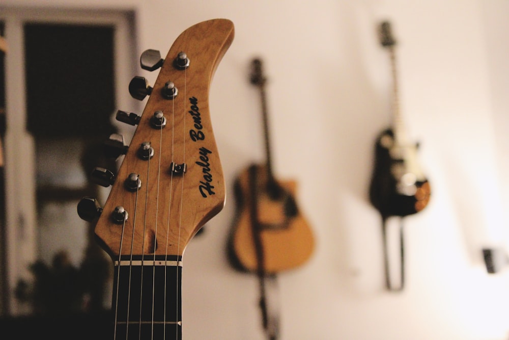 brown and black acoustic guitar