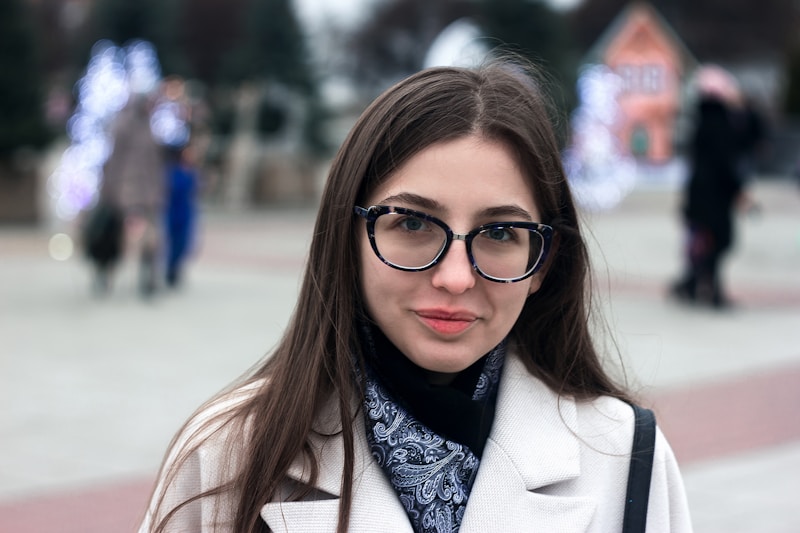 Sophisticated woman in coat glasses