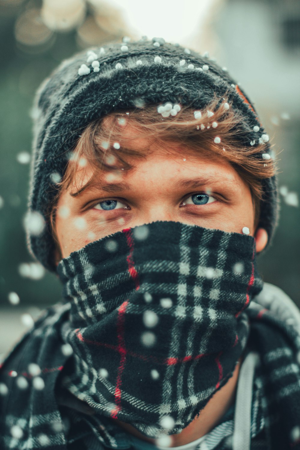 woman in black and white knit cap