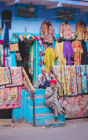 woman in brown and white dress sitting on brown wooden chair