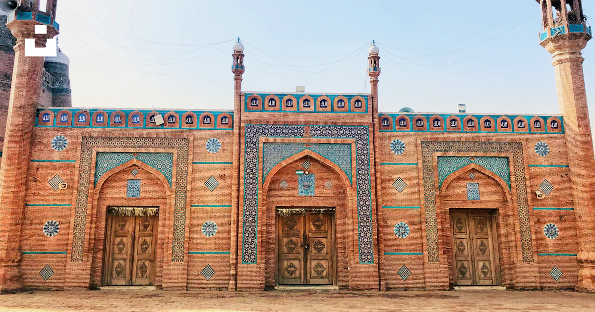 A large building with two towers and a door photo – Free Multan Image ...