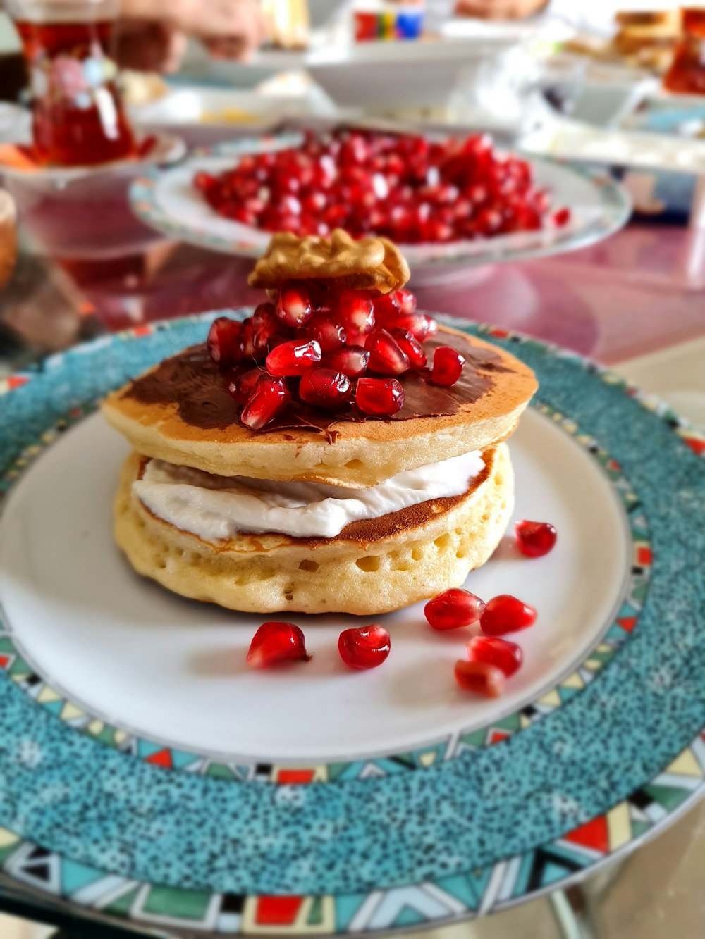 pancake with strawberry on white ceramic plate