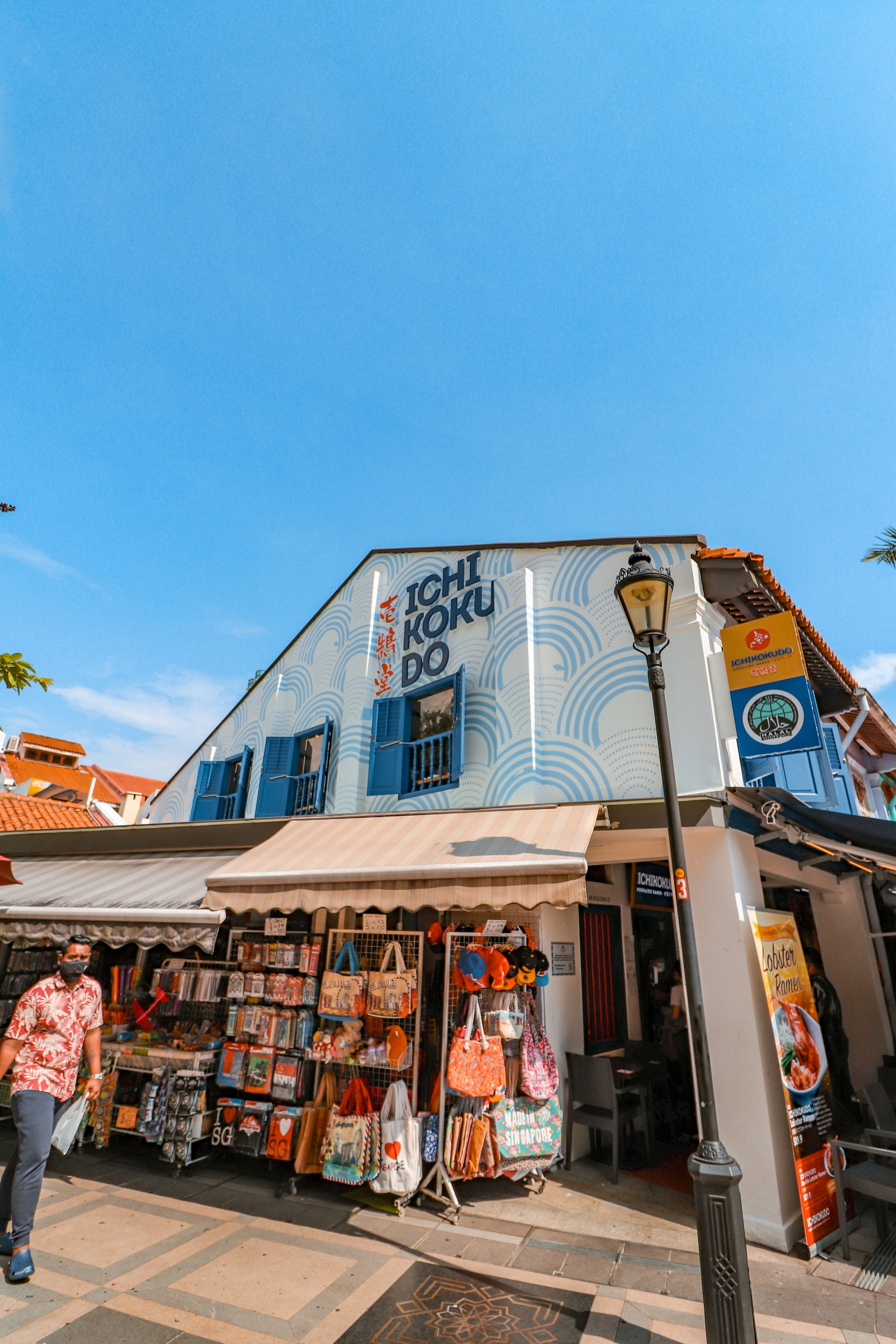 woman wearing yellow long-sleeved dress under white clouds and blue sky during daytime