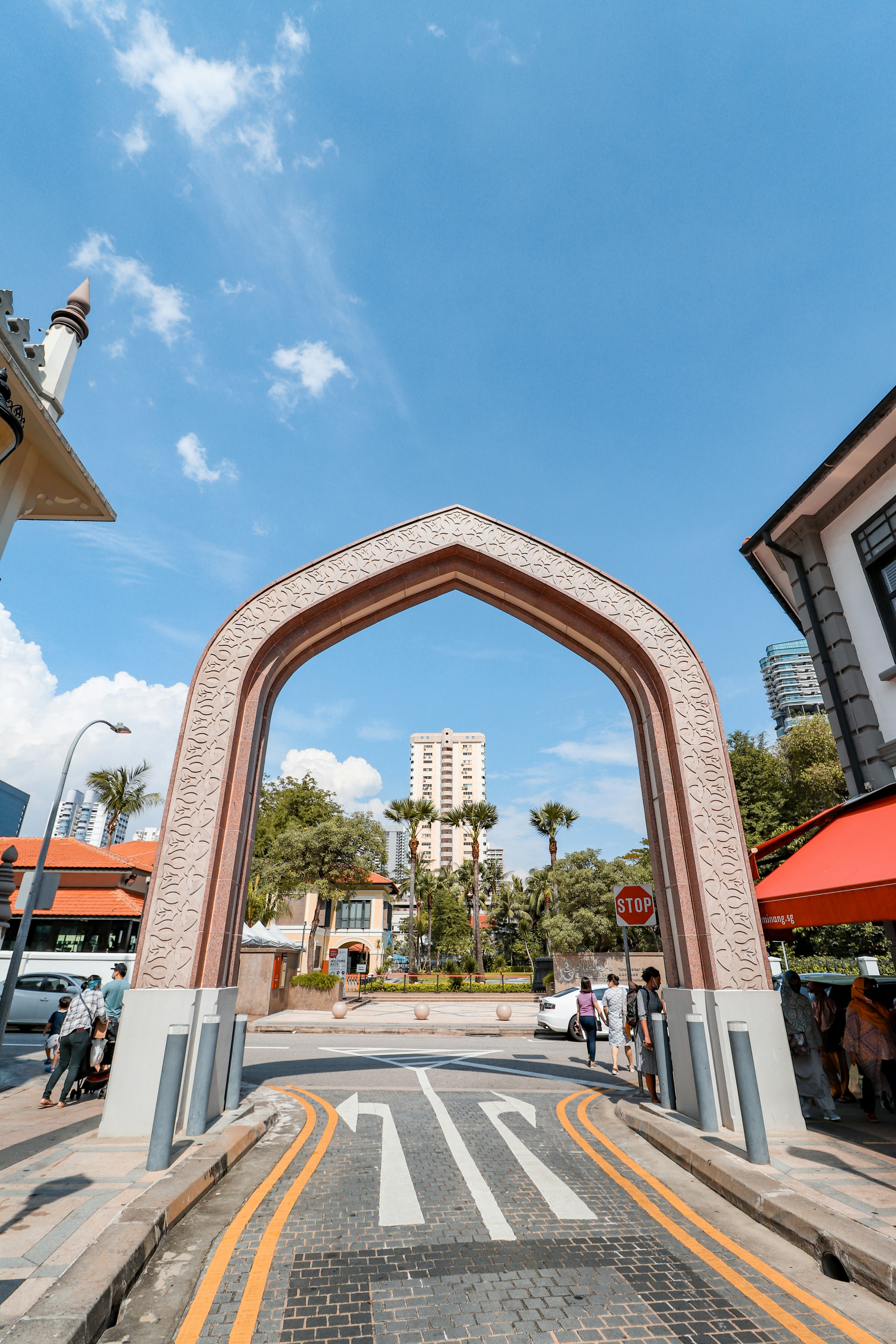 cars parked in front of brown concrete building during daytime