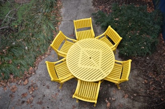 yellow wooden bench on green grass