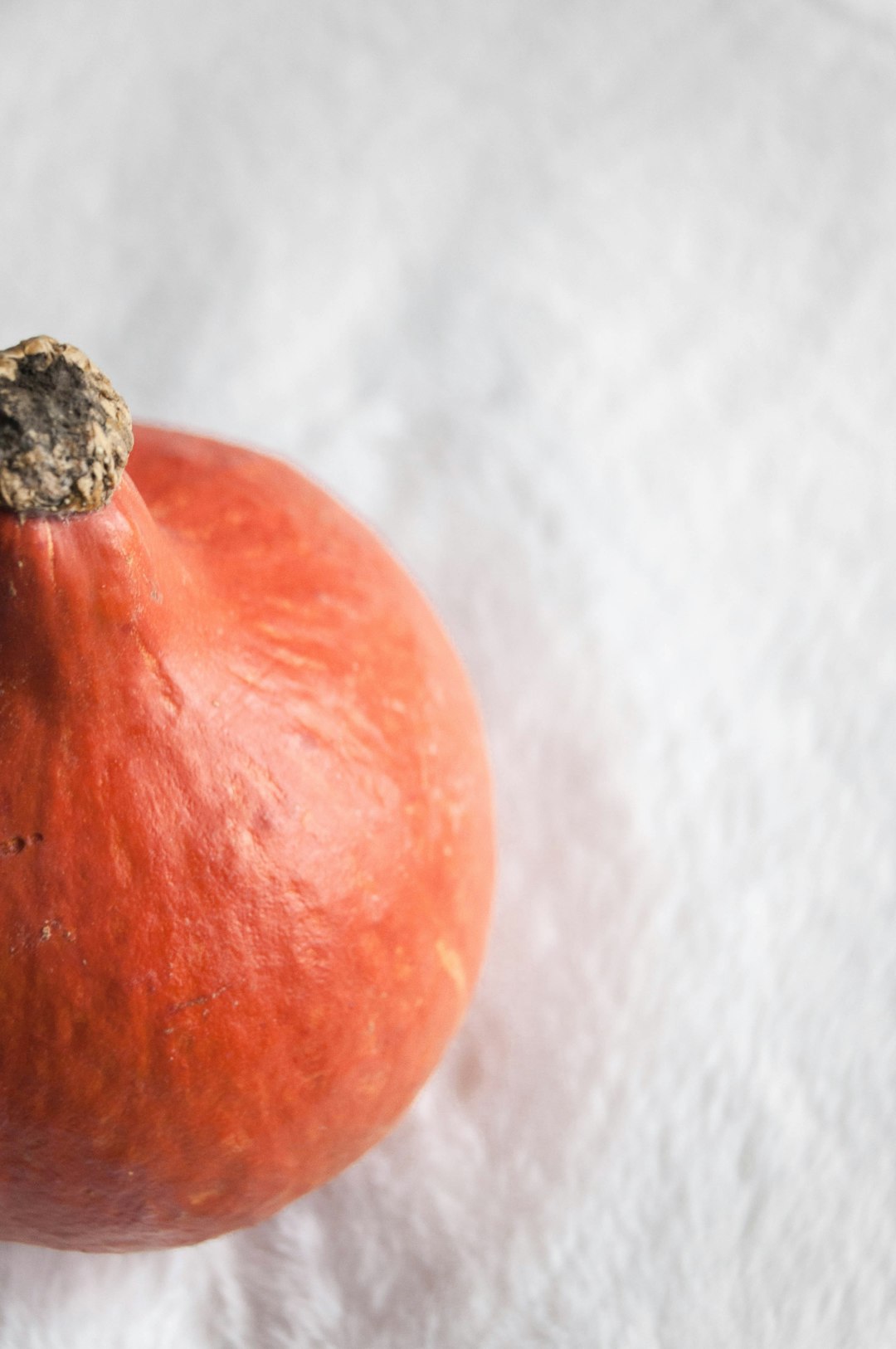 red round fruit on white textile