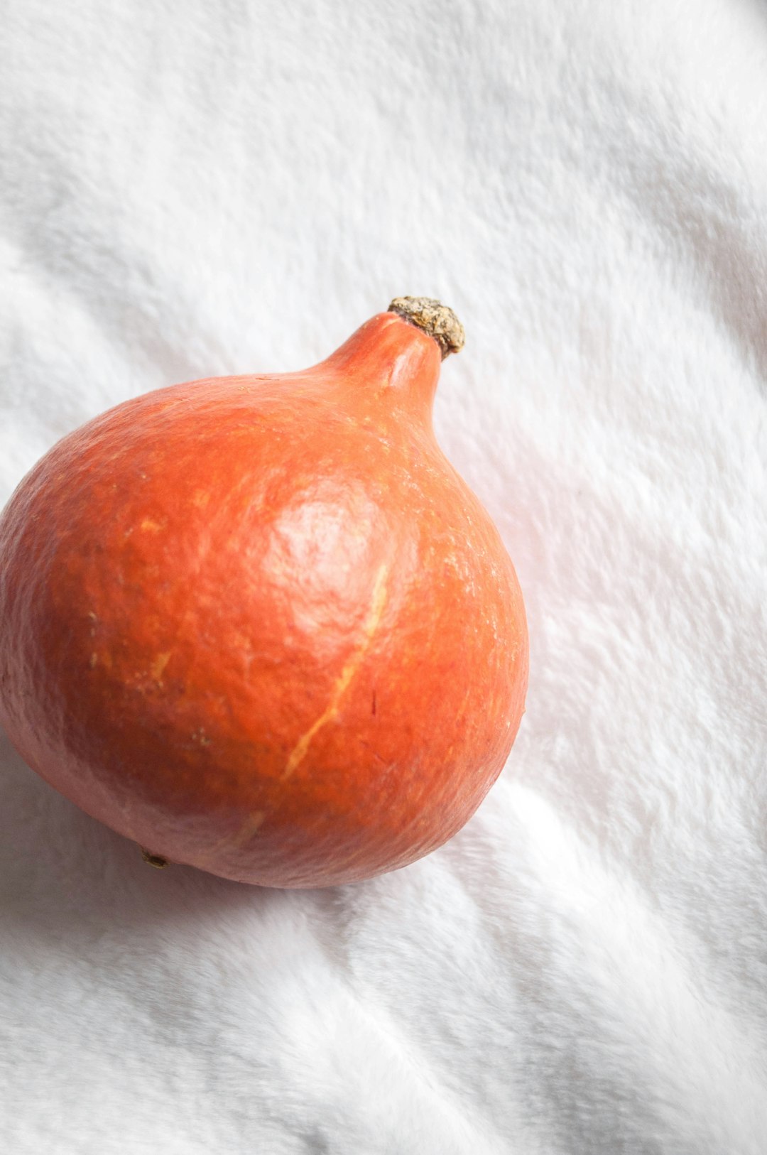 red round fruit on white textile