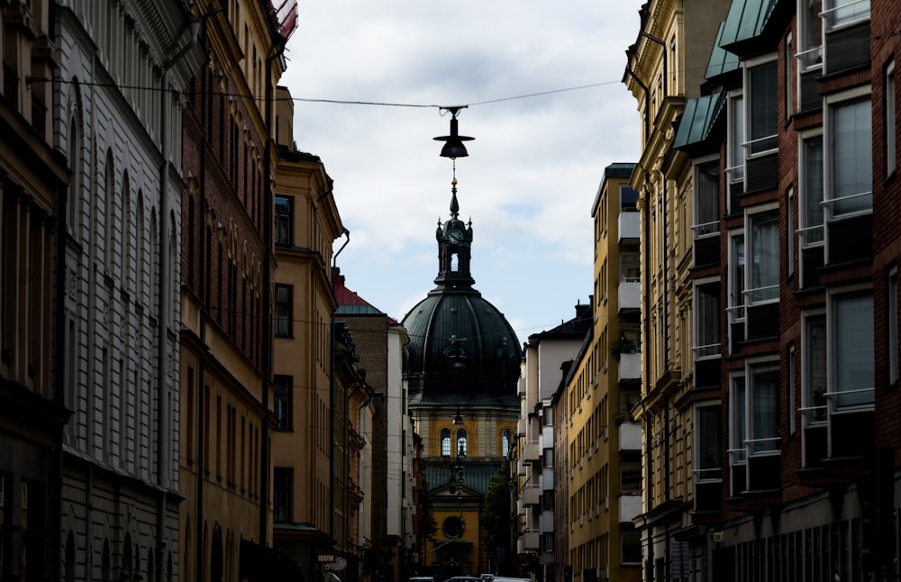 black cross on the street during daytime