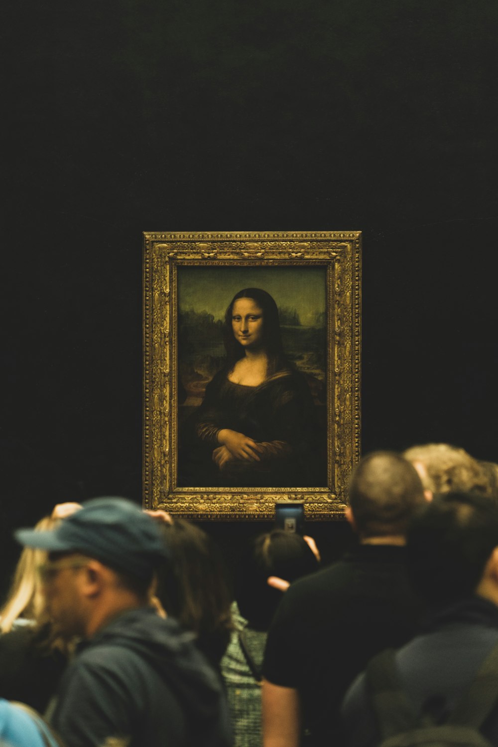 man in white hat and black shirt painting