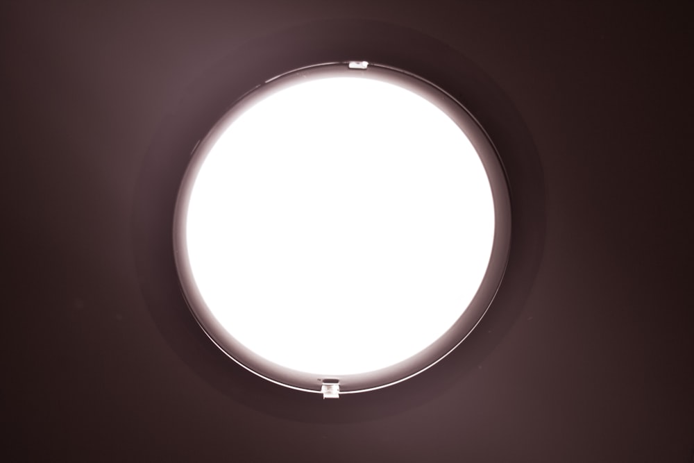 white round light on white ceiling