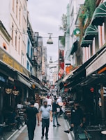 A vibrant street scene featuring people in trendy clothing.
