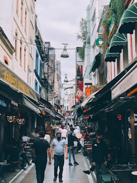 A bustling urban area with shops and cafes.