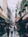 A vibrant street scene showcasing various shops and eateries bustling with activity.