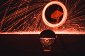 A close-up of a crystal ball reflecting cosmic patterns.