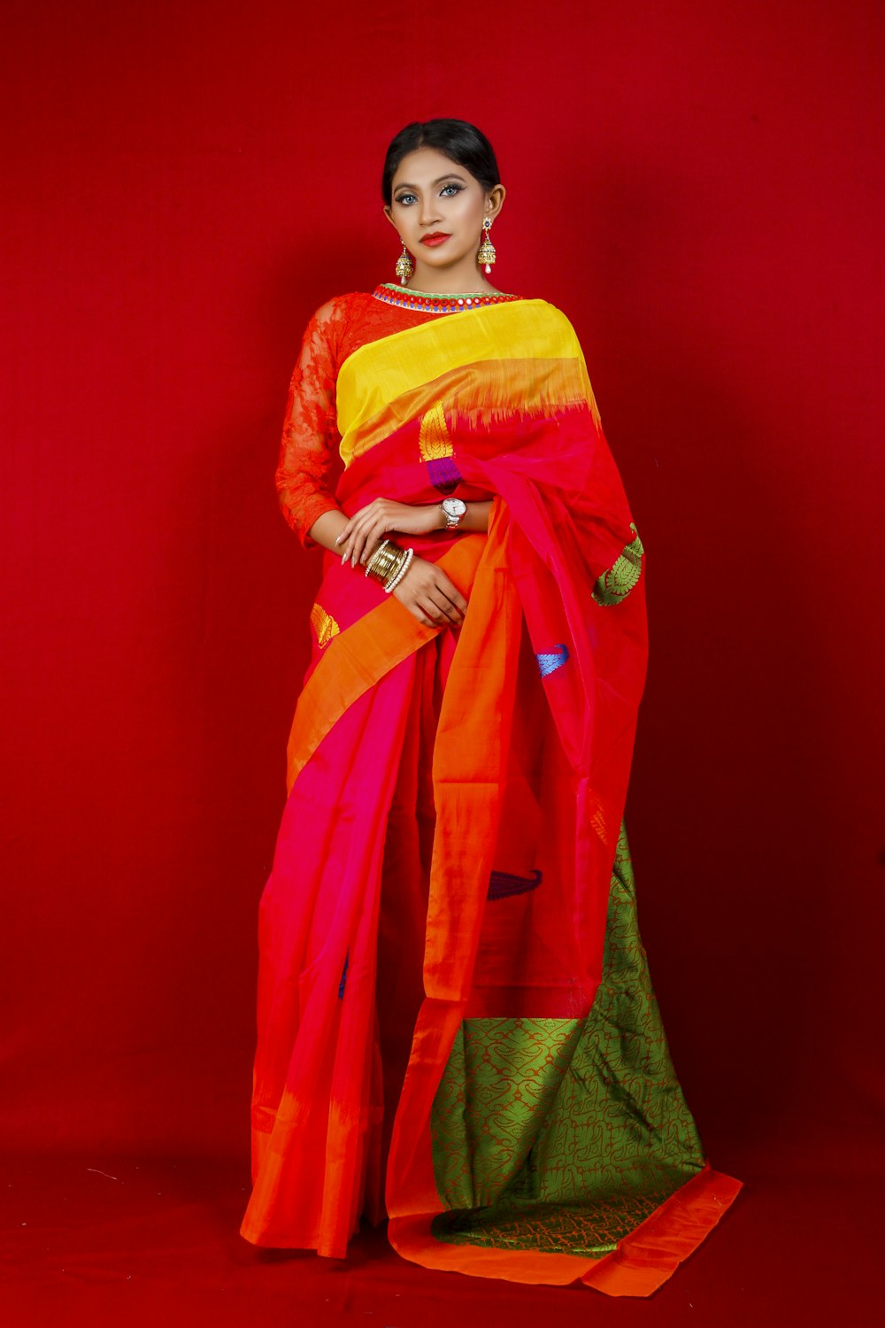 woman in red and green sari