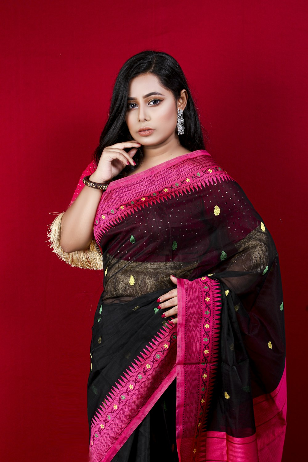 woman in red and brown sari