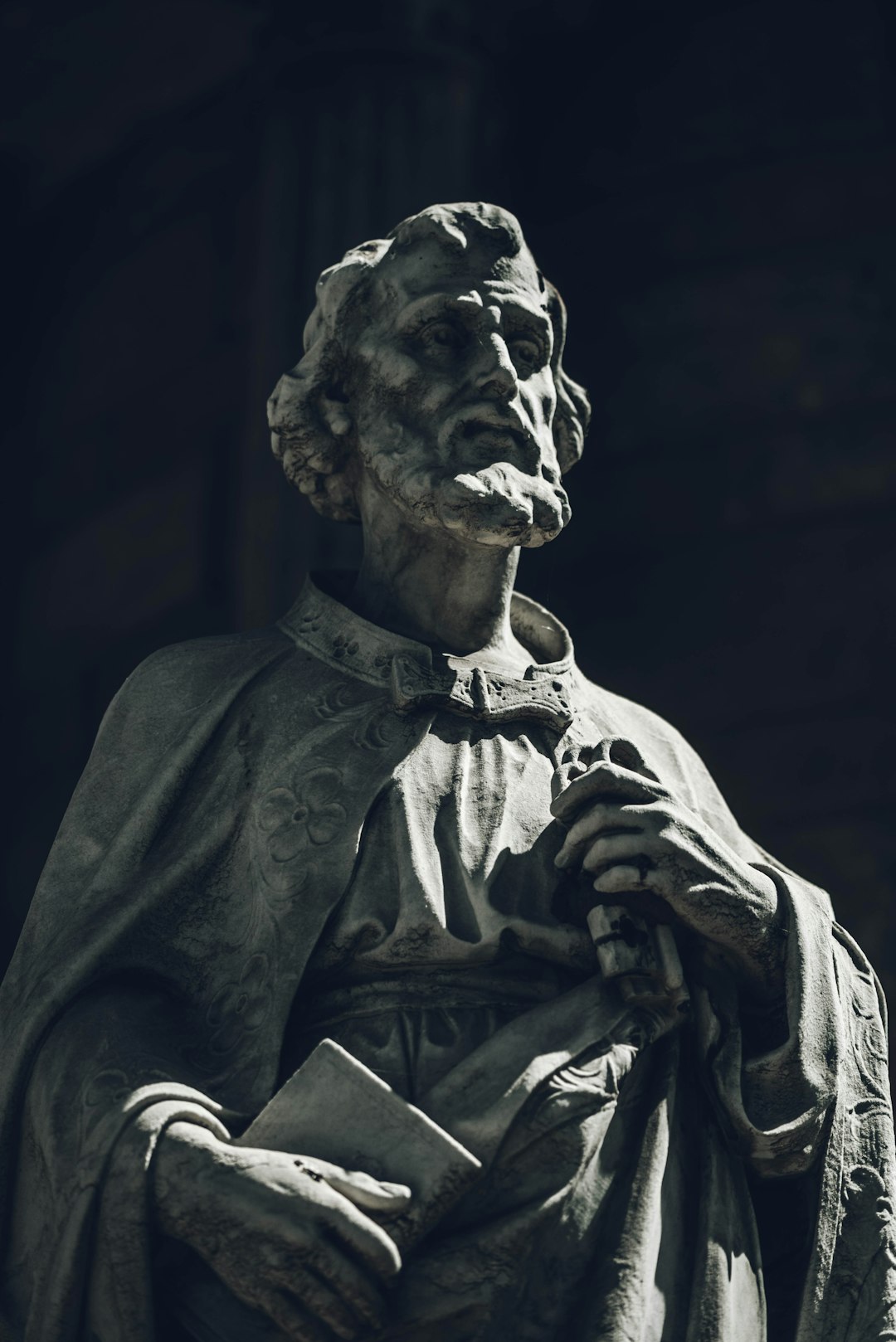 man in white dress shirt statue