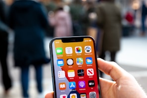 a person holding an iphone in their hand